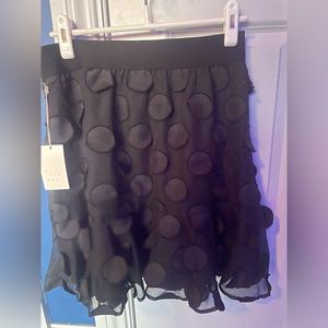 Black sheer skirt .elastic waist flowing polka-dots